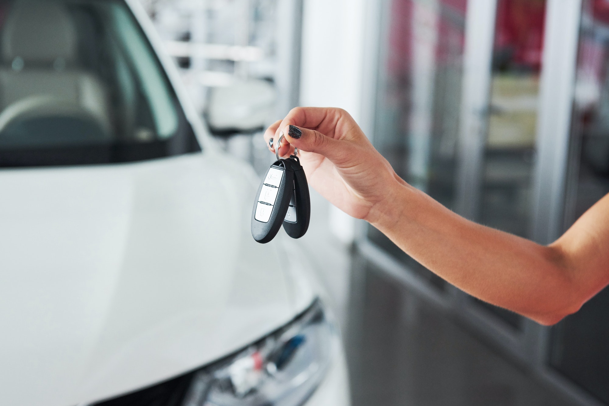 passing-car-keys-cropped-closeup-of-a-car-dealer-holding-out-car-keys-to-the-camera-copyspace-car.jpg